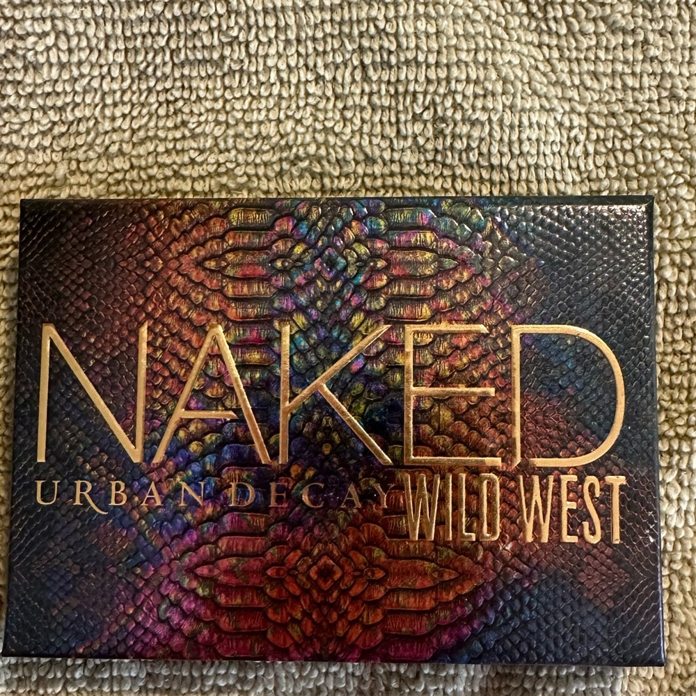 Urban Decay Eyeshadow Palette with Cream, Gold, and Green Shades